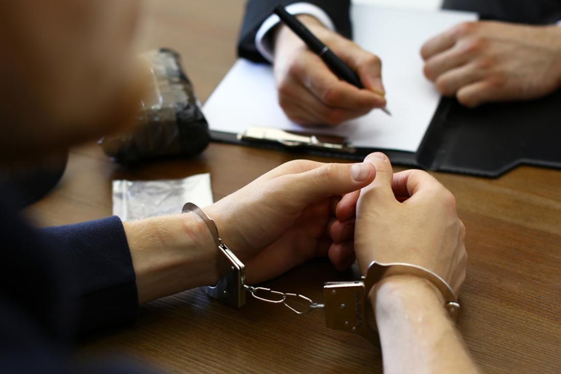 Attorney meeting with a client facing criminal charges